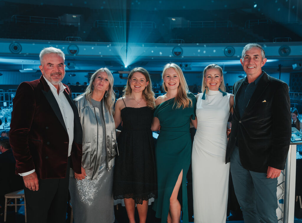 The Floresco Co-Founders Smiling For The Camera At An Awards Ceremony