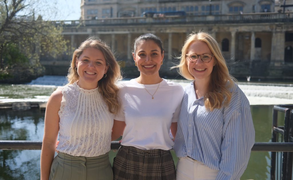 Floresco team smiling to the camera at the weir in Bath.