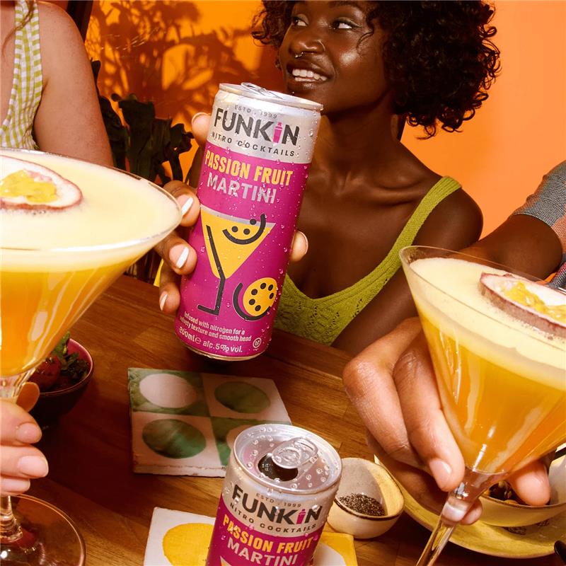 Photograph of a party scene featuring FUNKIN cocktail cans