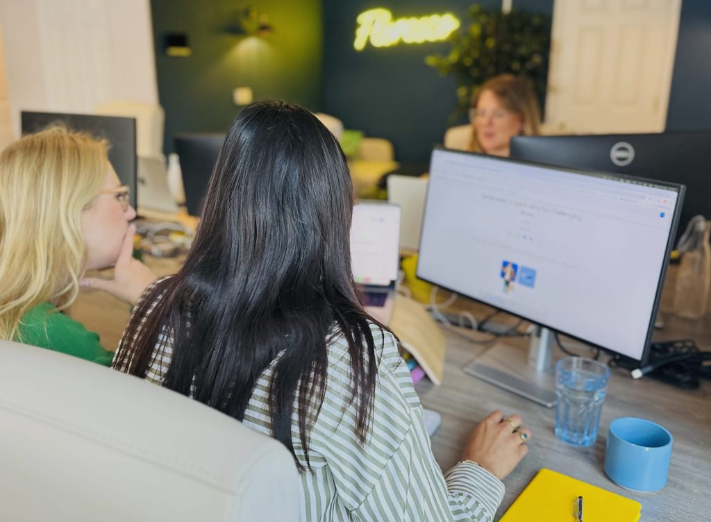 Floresco Media team working in their office, at their desks.