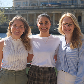 Three women smiling for a photo