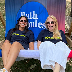 Two women sat in large deckchair