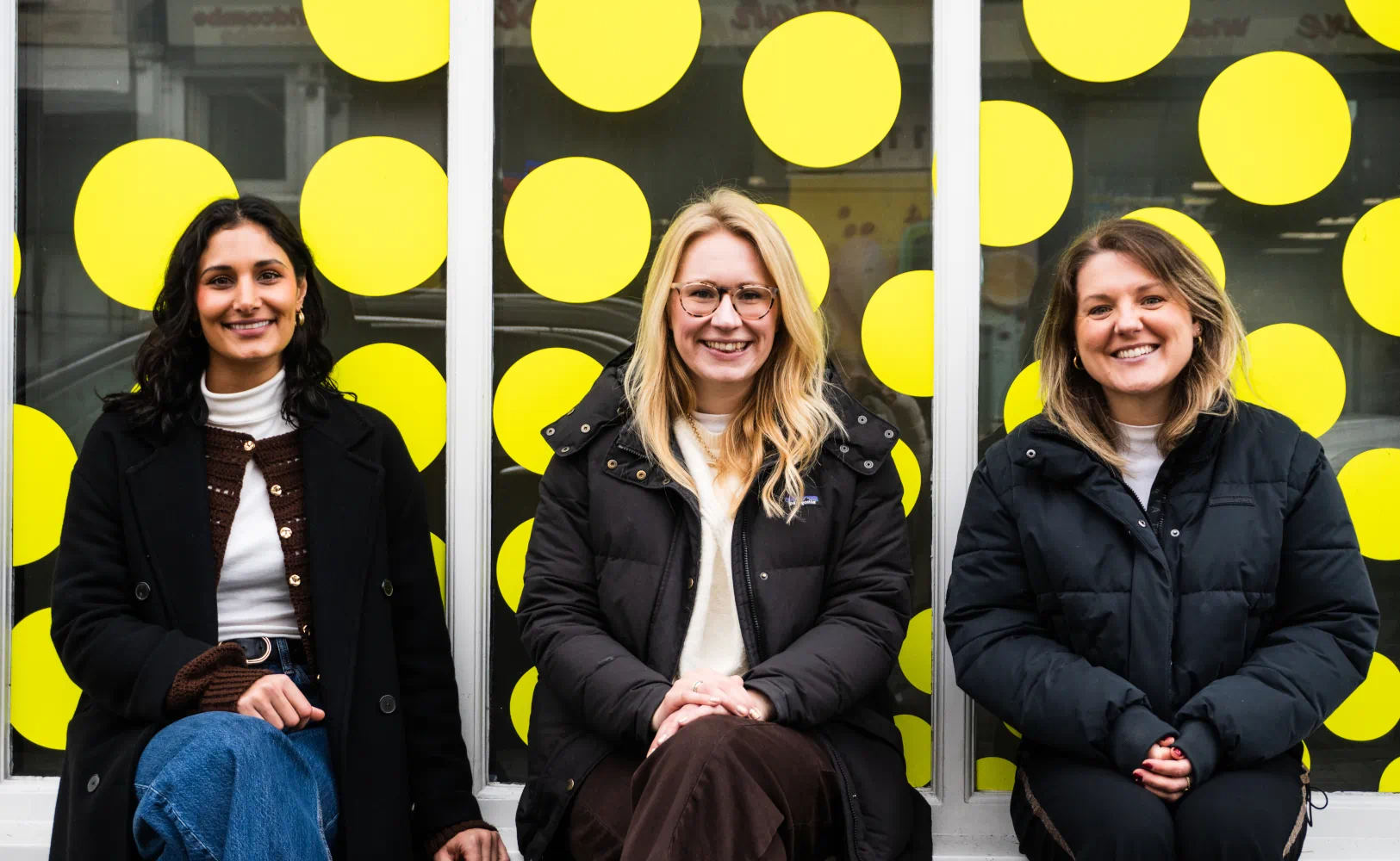 Three of the floresco media team sat outside the Floresco head office in Bath
